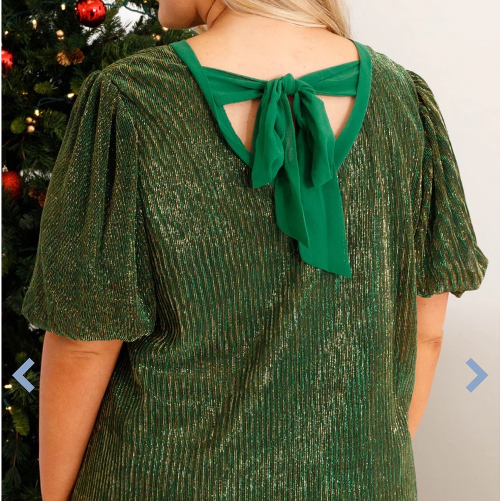 Green shimmery shirt, great for going out.